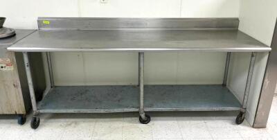 8' STAINLESS STEEL TABLE WITH GALVANIZED UNDERSHELF ON CASTERS