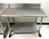 4' STAINLESS STEEL TABLE WITH GALVANIZED UNDERSHELF ON CASTERS