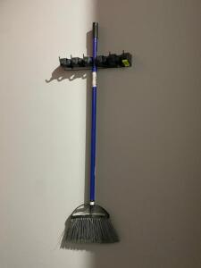 DESCRIPTION: WALL MOUNTED LONG HANDLE TOOL HOLDER W/ DUST MOP AND BROOM LOCATION: BATHROOM THIS LOT IS: ONE MONEY QTY: 1