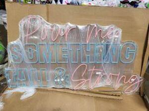 DESCRIPTION: (1) NEON LIGHT INFORMATION: "POUR ME SOMETHING TALL & STRONG" PINK AND BLUE RETAIL$: $1000.00 EA QTY: 1