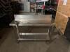 DESCRIPTION: 51" X 18" STAINLESS PREP TABLE W/ MOUNTED COMMERCIAL CAN OPENER ON CASTERS INFORMATION: 6" BACKSPLASH SIZE: 51" X 18" X 33" QTY: 1 - 3