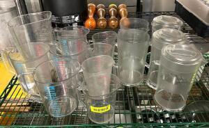 DESCRIPTION: CONTENTS OF SHELF (VARIOUS PITCHERS AND MEASURING CUPS AS SHOWN) QTY: 1