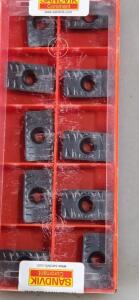 DESCRIPTION: (40) CARBIDE MILLING INSERTS BRAND/MODEL: SANDVIK COROMANT/LPMH 25 06 10-PM RETAIL$: $ 30.40 PER INSERT QTY: 40