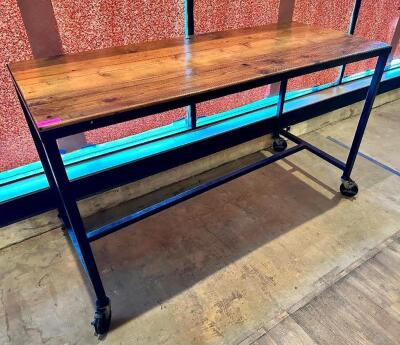 72" X 30" HARDWOOD TABLE TOP W/ METAL FRAME AND CASTERS. (PUB HEIGHT)