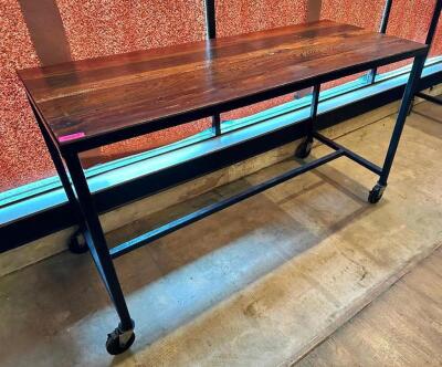 72" X 30" HARDWOOD TABLE TOP W/ METAL FRAME AND CASTERS. (PUB HEIGHT)