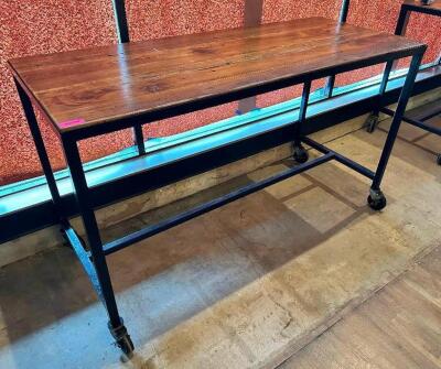 72" X 30" HARDWOOD TABLE TOP W/ METAL FRAME AND CASTERS. (PUB HEIGHT)