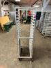 DESCRIPTION: TWENTY PAN FRONT LOAD TRAY RACK - ON CASTERS LOCATION: BAY 6 QTY: 1 - 2