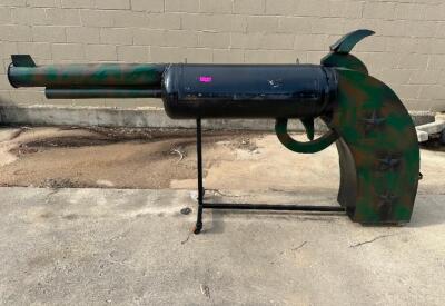 PISTOL BBQ PIT . SMOKE COMES OUT THE BARREL.