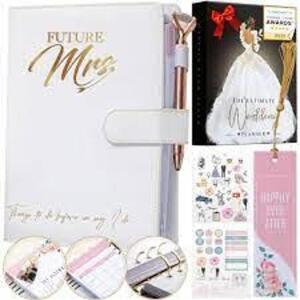 DESCRIPTION: (2) PLANNER BOOK BRAND/MODEL: DELUXE ULTIMATE WEDDING PLANNER BOOK RETAIL$: $32.99 EA QTY: 2