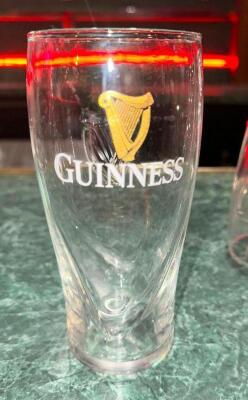 DESCRIPTION: (16) GUINNESS LOGO PILSNER GLASSES LOCATION: BAR THIS LOT IS: SOLD BY THE PIECE QTY: 16