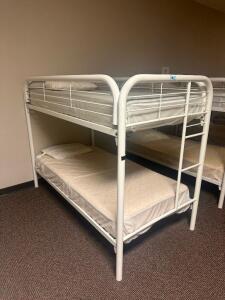 DESCRIPTION: TWIN OVER TWIN WHITE METAL FRAMED BUNK BED WITH MATTRESSES RETAIL PRICE: 233.8 ADDITIONAL INFORMATION: GREAT CONDITION WITH MINOR COSMETI