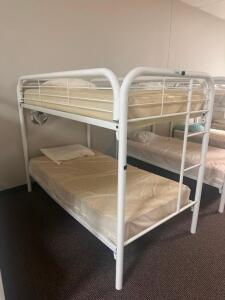 DESCRIPTION: TWIN OVER TWIN WHITE METAL FRAMED BUNK BED WITH MATTRESSES RETAIL PRICE: 233.8 ADDITIONAL INFORMATION: GREAT CONDITION WITH MINOR COSMETI