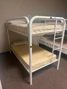 DESCRIPTION: TWIN OVER TWIN WHITE METAL FRAMED BUNK BED WITH MATTRESSES RETAIL PRICE: 233.8 ADDITIONAL INFORMATION: GREAT CONDITION WITH MINOR COSMETI