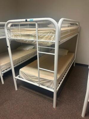 DESCRIPTION: TWIN OVER TWIN WHITE METAL FRAMED BUNK BED WITH MATTRESSES RETAIL PRICE: 233.8 ADDITIONAL INFORMATION: GREAT CONDITION WITH MINOR COSMETI
