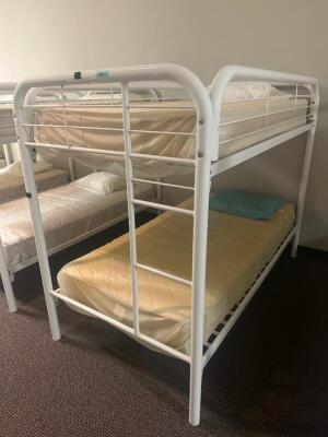 DESCRIPTION: TWIN OVER TWIN WHITE METAL FRAMED BUNK BED WITH MATTRESSES RETAIL PRICE: 233.8 ADDITIONAL INFORMATION: GREAT CONDITION WITH MINOR COSMETI