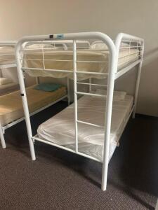 DESCRIPTION: TWIN OVER TWIN WHITE METAL FRAMED BUNK BED WITH MATTRESSES RETAIL PRICE: 233.8 ADDITIONAL INFORMATION: GREAT CONDITION WITH MINOR COSMETI