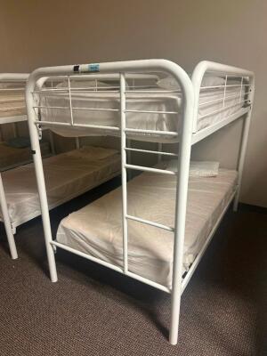 DESCRIPTION: TWIN OVER TWIN WHITE METAL FRAMED BUNK BED WITH MATTRESSES RETAIL PRICE: 233.8 ADDITIONAL INFORMATION: GREAT CONDITION WITH MINOR COSMETI