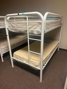 DESCRIPTION: TWIN OVER TWIN WHITE METAL FRAMED BUNK BED WITH MATTRESSES RETAIL PRICE: 233.8 ADDITIONAL INFORMATION: GREAT CONDITION WITH MINOR COSMETI