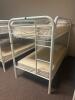 DESCRIPTION: TWIN OVER TWIN WHITE METAL FRAMED BUNK BED WITH MATTRESSES RETAIL PRICE: 233.8 ADDITIONAL INFORMATION: GREAT CONDITION WITH MINOR COSMETI