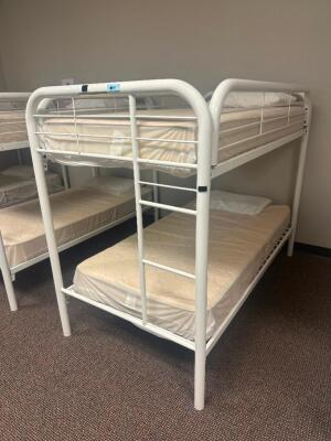 DESCRIPTION: TWIN OVER TWIN WHITE METAL FRAMED BUNK BED WITH MATTRESSES RETAIL PRICE: 233.8 ADDITIONAL INFORMATION: GREAT CONDITION WITH MINOR COSMETI