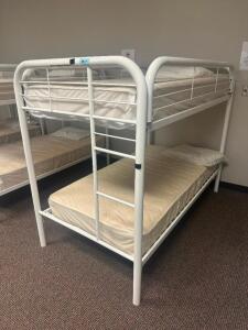 DESCRIPTION: TWIN OVER TWIN WHITE METAL FRAMED BUNK BED WITH MATTRESSES RETAIL PRICE: 233.8 ADDITIONAL INFORMATION: GREAT CONDITION WITH MINOR COSMETI