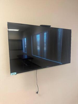 DESCRIPTION: 50" LED FLAT SCREEN TV WITH WALL MOUNT BRAND / MODEL: POLAROID ADDITIONAL INFORMATION: CONTROLER INCLUDED. SIZE: SEE PHOTOS LOCATION: CLI