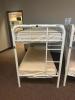 DESCRIPTION: (2) - TWIN OVER TWIN WHITE METAL FRAMED BUNK BEDS WITH MATTRESSES RETAIL PRICE: $233.80 EACH ADDITIONAL INFORMATION: (2) - BUNK BEDS TOTA - 4