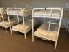 DESCRIPTION: (2) - TWIN OVER TWIN WHITE METAL FRAMED BUNK BEDS WITH MATTRESSES RETAIL PRICE: $233.80 EACH ADDITIONAL INFORMATION: (2) - BUNK BEDS TOTA - 2