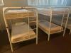 DESCRIPTION: (2) - TWIN OVER TWIN WHITE METAL FRAMED BUNK BEDS WITH MATTRESSES RETAIL PRICE: $233.80 EACH ADDITIONAL INFORMATION: (2) - BUNK BEDS TOTA - 2