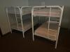 DESCRIPTION: (2) - TWIN OVER TWIN WHITE METAL FRAMED BUNK BEDS WITH MATTRESSES RETAIL PRICE: $233.80 EACH ADDITIONAL INFORMATION: (2) - BUNK BEDS TOTA - 2