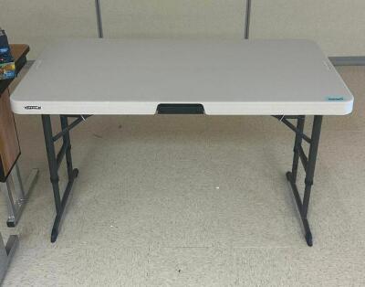 DESCRIPTION: 4 FT. FOLDING TABLE BRAND / MODEL: LIFETIME LOCATION: CLINIC 7 THIS LOT IS: ONE MONEY QTY: 1