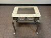 DESCRIPTION: 26" GLASS TOP COFFEE TABLE LOCATION: CLINIC 7 THIS LOT IS: ONE MONEY QTY: 1 - 2