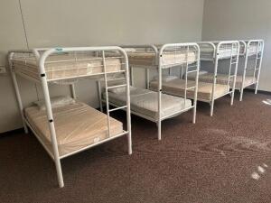 DESCRIPTION: (4) - TWIN OVER TWIN WHITE METAL FRAMED BUNK BEDS WITH MATTRESSES RETAIL PRICE: $233.80 EACH ADDITIONAL INFORMATION: (4) - BUNK BEDS TOTA