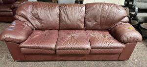 THREE CUSHION MAROON PLEATHER SOFA