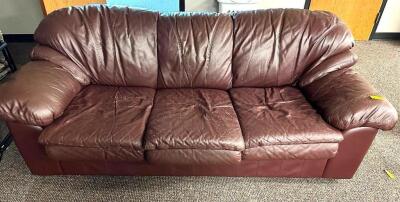 THREE CUSHION MAROON PLEATHER SOFA