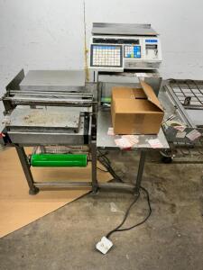 DESCRIPTION: CASE DIGITAL DELI SCALE AND WRAPPING STATION BRAND / MODEL: CASE LOCATION: BACK WAREHOUSE QTY: 1