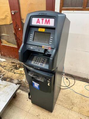 DESCRIPTION: TRITON ATM MACHINE BRAND / MODEL: TRITON ADDITIONAL INFORMATION COMES WITH KEY. IN WORKING ORDER LOCATION: FLOOR QTY: 1