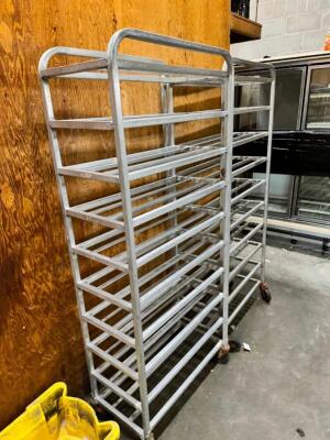 DESCRIPTION: (3) HALF SIZE DELI TRAY RACKS. ADDITIONAL INFORMATION ALL WITH BAD CASTERS LOCATION: BACK WAREHOUSE THIS LOT IS: SOLD BY THE PIECE QTY: 3