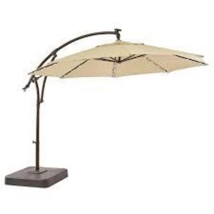 DESCRIPTION: (1) SOLAR LED OFFSET TABLE UMBRELLA WITH LIGHTS BRAND/MODEL: HAMPTON BAY #1003291822 INFORMATION: TAN RETAIL$: $699.00 EA SIZE: 11 FT QTY