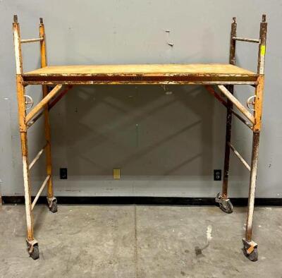 DESCRIPTION: 6' SCAFFOLDING SECTION ON CASTERS SIZE: 72"X30"X76" LOCATION: WAREHOUSE QTY: 1