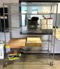 DESCRIPTION: 5-TIER WIRE SHELVING UNIT ON CASTERS INFORMATION: CONTENTS NOT INCLUDED SIZE: 60"X24"X77" LOCATION: WAREHOUSE QTY: 1