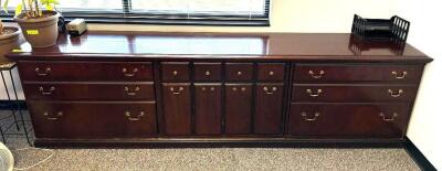 DESCRIPTION: WOODEN CREDENZA INFORMATION: CONTENTS NOT INCLUDED SIZE: 110" LOCATION: CORNER OFFICE QTY: 1