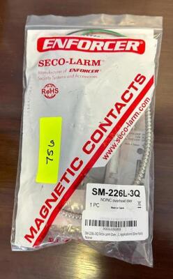 DESCRIPTION: SECO-LARM MAGNETIC CONTACTS FOR OVERHEAD DOOR BRAND/MODEL: ENFORCER SM-226L-3Q LOCATION: CORNER OFFICE QTY: 1