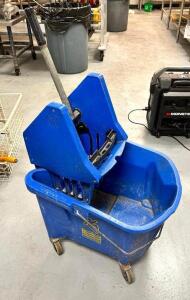 BLUE MOP BUCKET AND WRINGER.