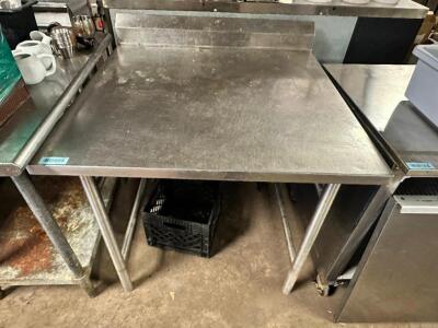 DESCRIPTION: 36" X 30" STAINLESS TABLE W/ 4" BACK SPLASH SIZE 36" X 30" LOCATION: BAY 7 QTY: 1