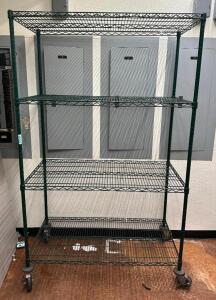 DESCRIPTION: 4-TIER WIRE SHELVING UNIT ON CASTERS SIZE: 48"X24"X79" LOCATION: STORAGE AREA QTY: 1