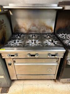 DESCRIPTION: US RANGE SIX BURNER GAS RANGE W/ LOWER OVEN. BRAND / MODEL: US RANGE ADDITIONAL INFORMATION NATURAL GAS. LOCATION: KITCHEN QTY: 1