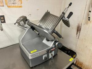 DESCRIPTION: HOBART 2912 COMMERCIAL DELI SLICER BRAND / MODEL: HOBART 2912 ADDITIONAL INFORMATION 1 PHASE, 115 VOLT. W/ BLADE SHARPENER LOCATION: KITC