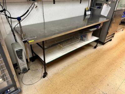 DESCRIPTION: 96" X 30" STAINLESS TABLE W/ MOUNTED CAN OPENER - ON CASTERS SIZE 96" X 30'" LOCATION: KITCHEN QTY: 1