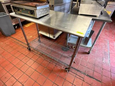 DESCRIPTION: 50" X 24" STAINLESS TABLE ON CASTERS. ADDITIONAL INFORMATION CONTENTS ARE NOT INCLUDED. SIZE 50" X 24" LOCATION: RESTAURANT QTY: 1